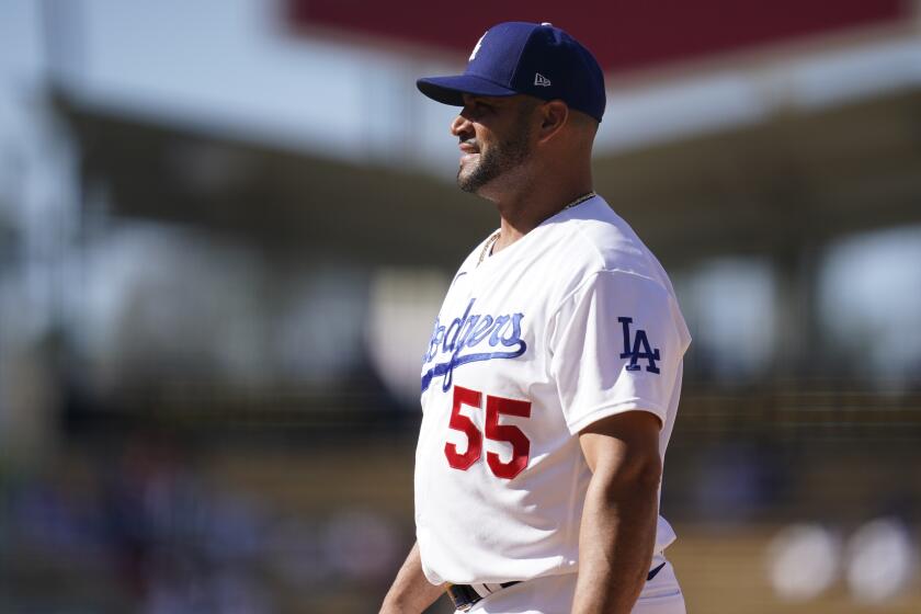 Los Angeles Dodgers first baseman Albert Pujols stands at first base during a baseball game against the Colorado Rockies Sunday, Aug. 29, 2021, in Los Angeles. (AP Photo/Ashley Landis)
