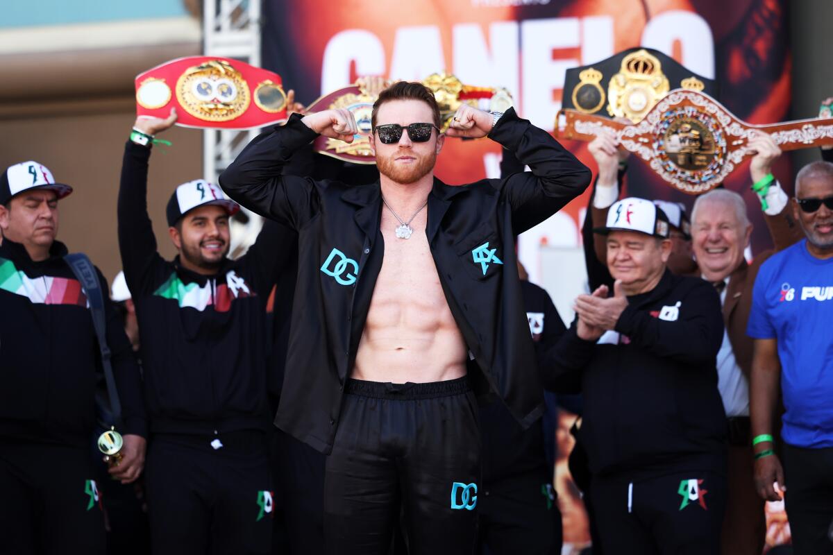 Canelo ?lvarez poses during his weigh-in Friday in Las Vegas.