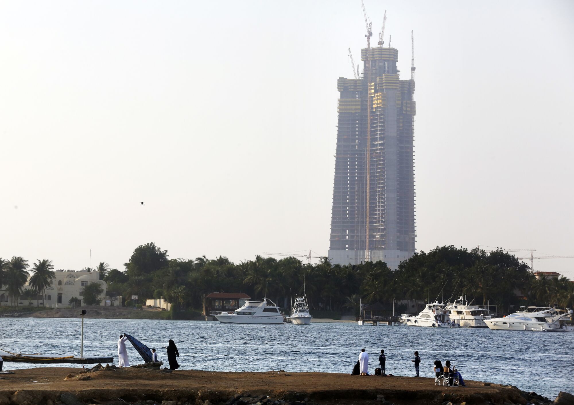 The unfinished Jeddah Tower skyscraper in the distance