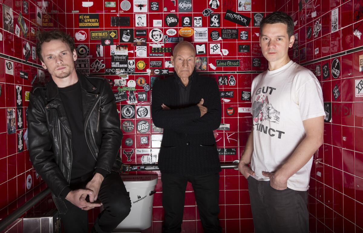 "Green Room's" Anton Yelchin, left, Patrick Stewart, center, and director Jeremy Saulnier pose at West Hollywood's Viper Room. (Brian van der Brug / Los Angeles Times)