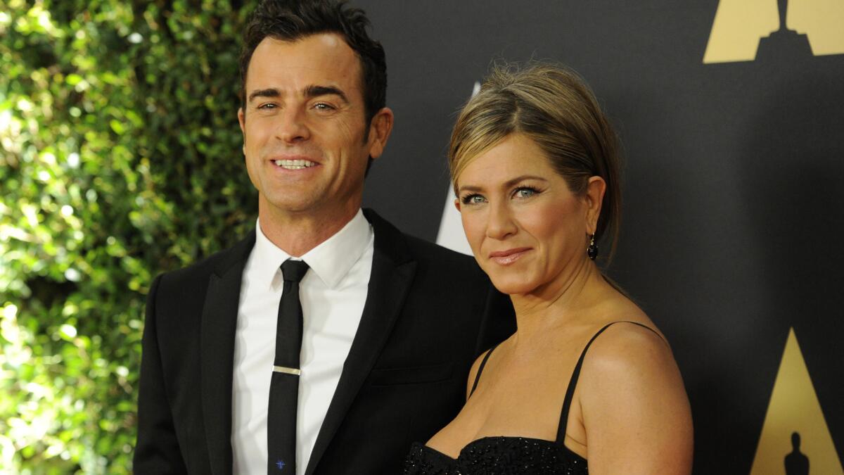 Justin Theroux and Jennifer Aniston arrive at the Academy of Motion Picture Arts and Sciences' sixth annual Governors Awards in Hollywood on Saturday.