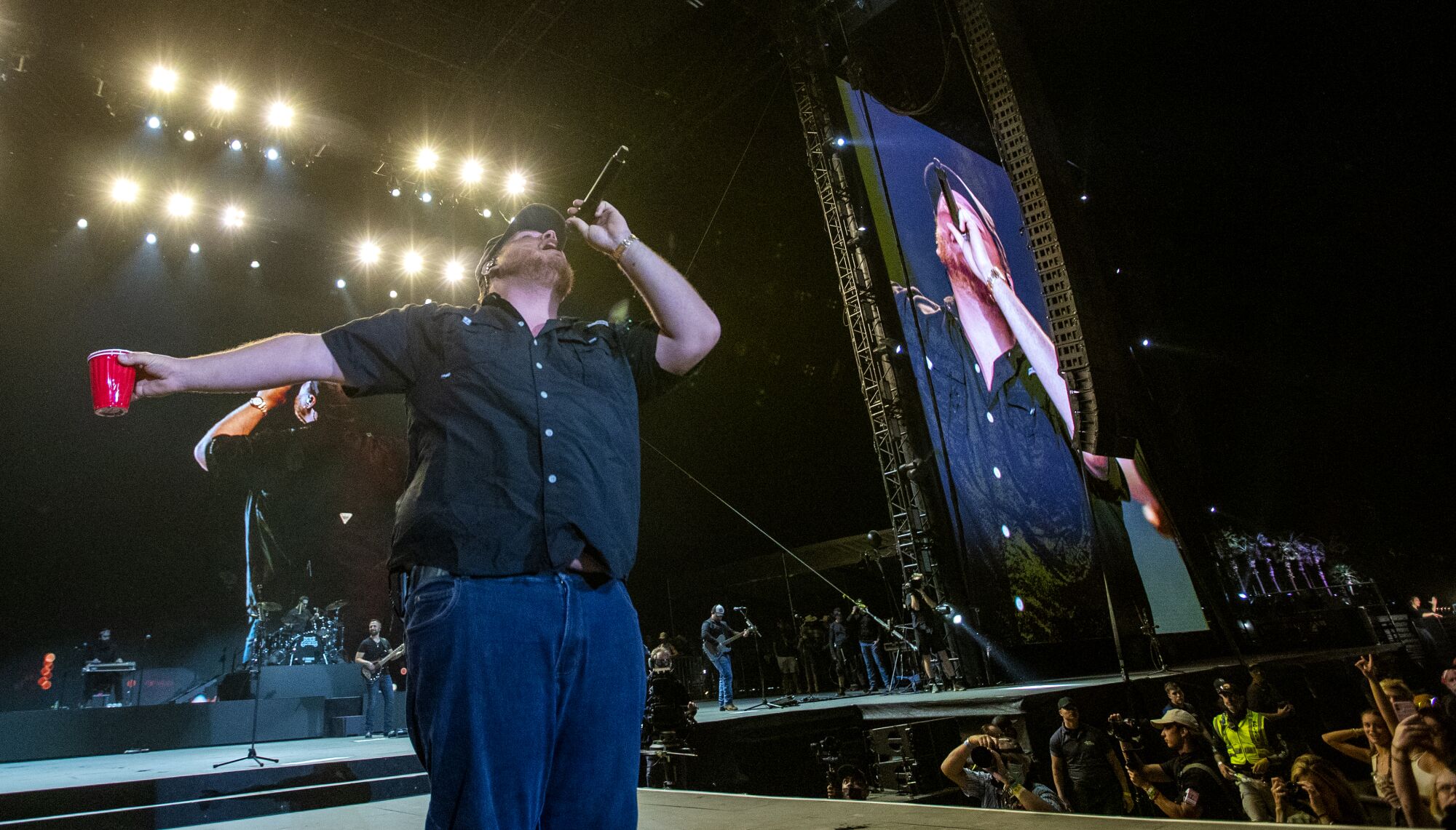 Sunday headliner Luke Combs belts.