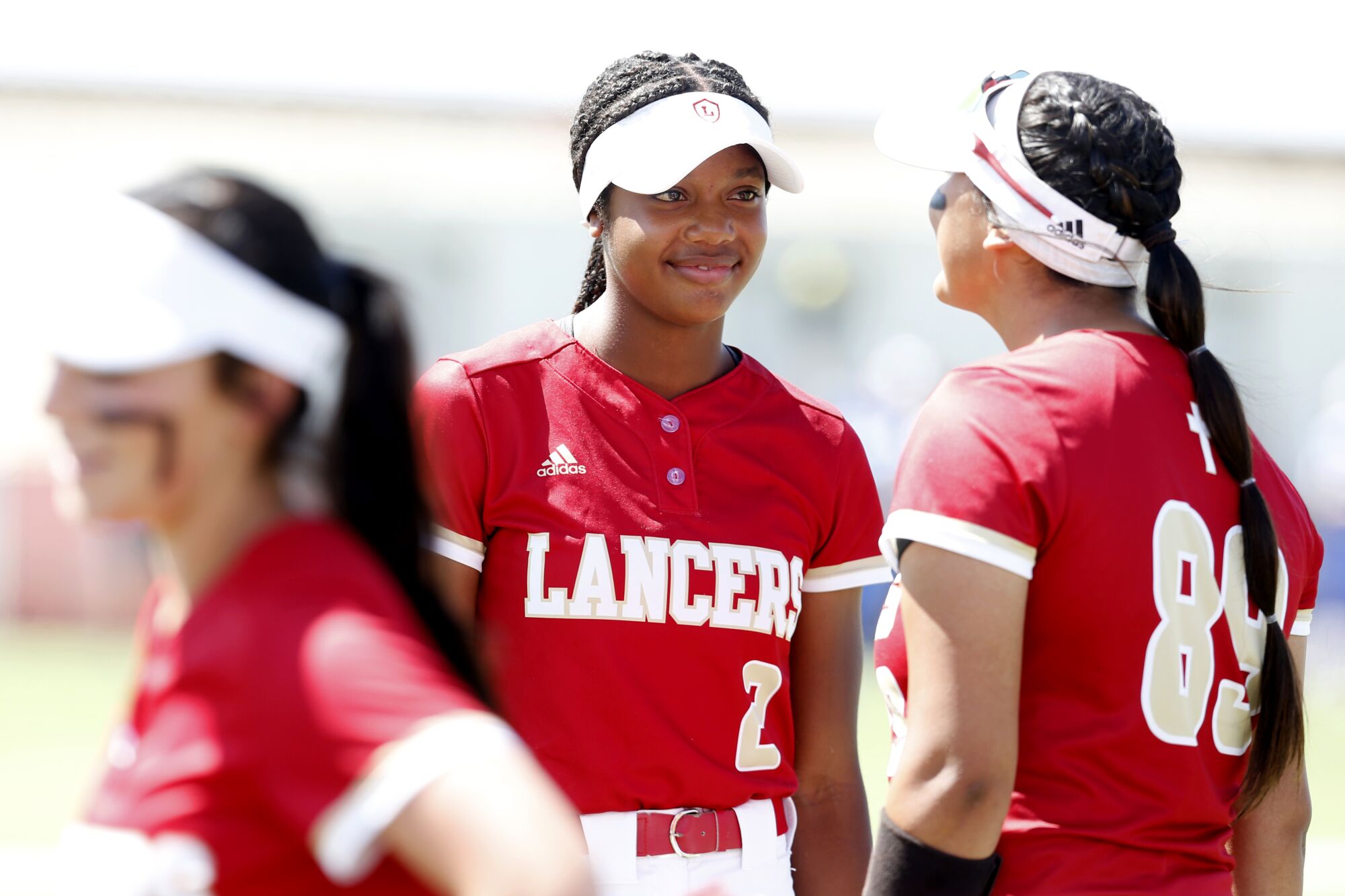 Kai Minor, center, talks to teammate Kiki Estrada before the start of a game against Santa Margarita.