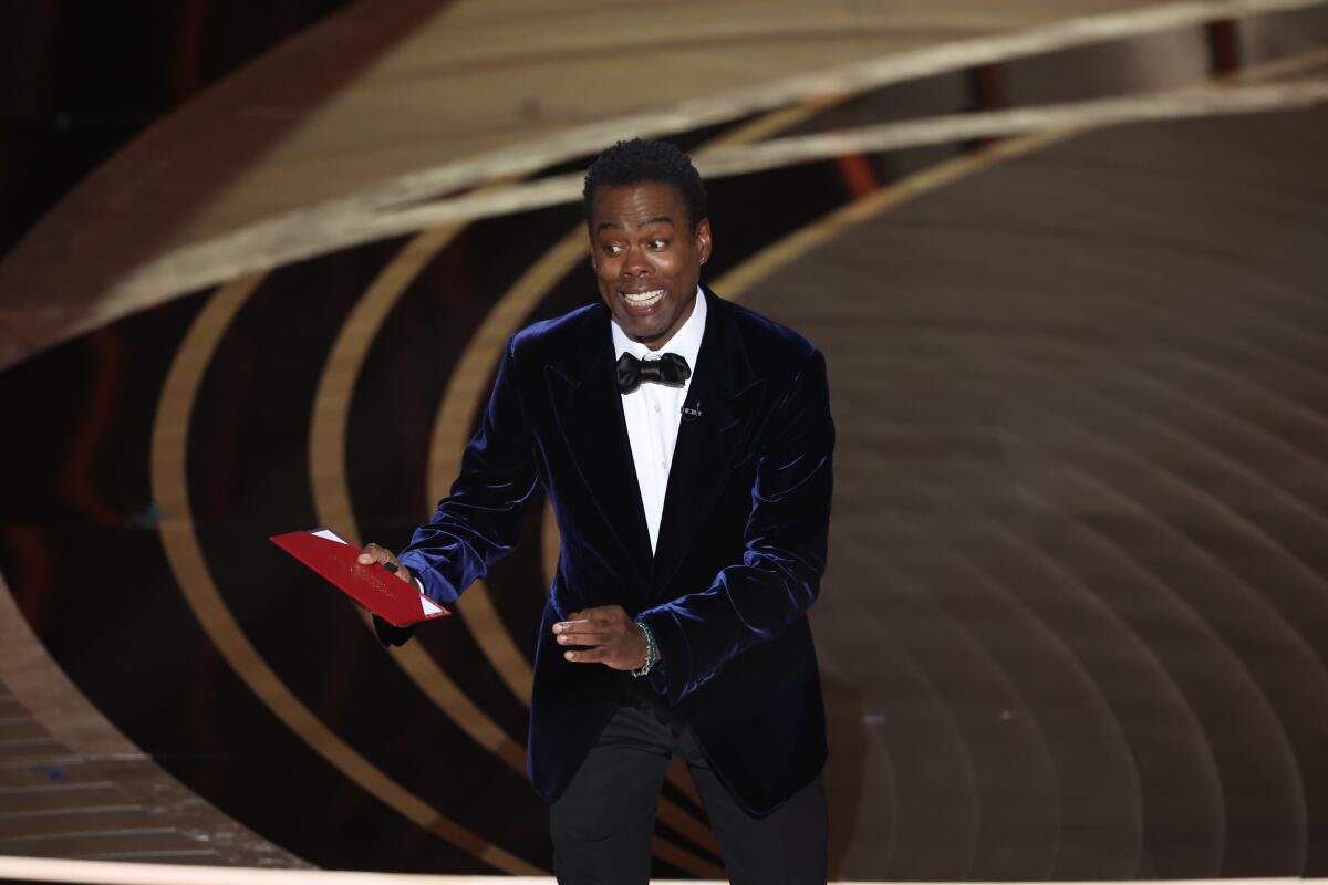 Chris Rock onstage at the Oscars