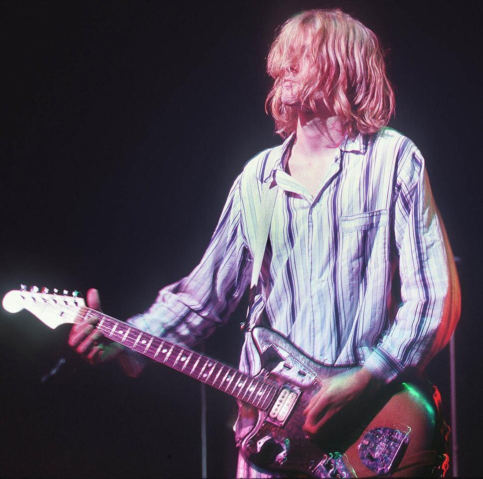 Kurt Cobain, lead singer for grunge rock group Nirvana, performing at the Nakano Sun Plaza in Tokyo two years before his death.