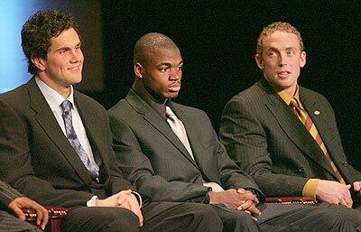 Southern Cal quarterback Matt Leinart, left, sits with Oklahoma running back Adrian Peterson, center, and Jason White while waiting for the announcement of the Heisman Trophy winner.