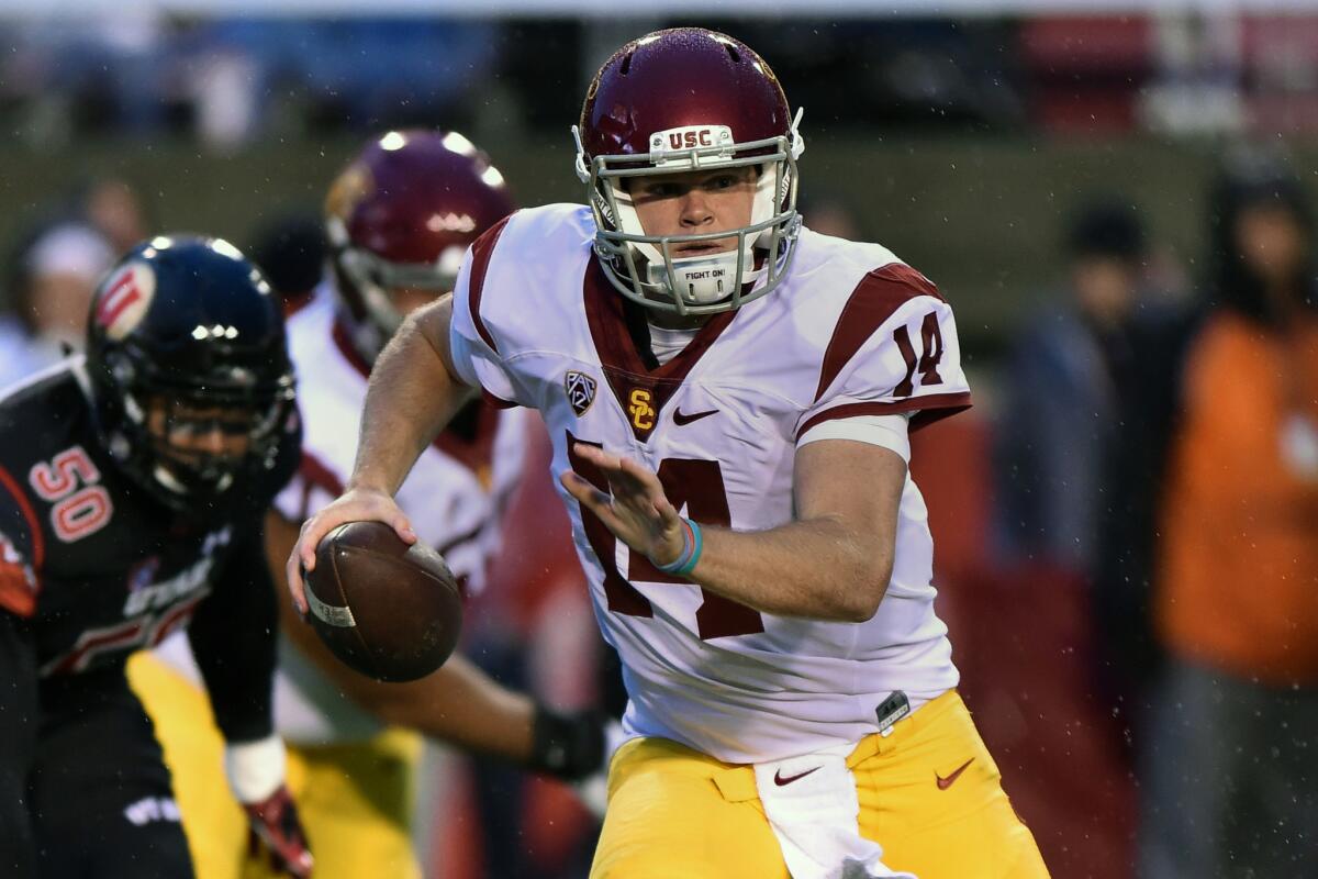 USC quarterback Sam Darnold runs with the ball in the first quarter against the Utah.