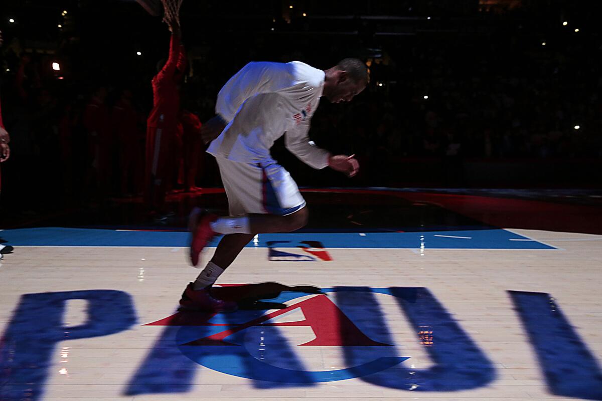 Clippers point guard Chris Paul takes the court during pregame introductions in the season opener game against the Thunder on Oct. 30, 2014, at Staples Center (Robert Gauthier/Los Angeles Times)