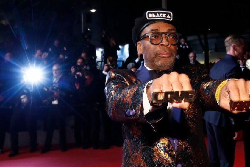 Mandatory Credit: Photo by IAN LANGSDON/EPA-EFE/REX/Shutterstock (9671102fq) Director Spike Lee leaves the screening of 'BlacKkKlansman' during the 71st annual Cannes Film Festival, in Cannes, France, 14 May 2018. The movie is presented in the Official Competition of the festival which runs from 08 to 19 May. BlacKkKlansman Premiere - 71st Cannes Film Festival, France - 14 May 2018 ** Usable by LA, CT and MoD ONLY **
