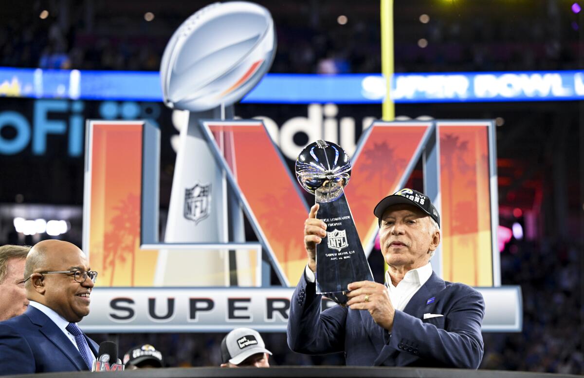 Owner Stan Kroenke holds the Lombardi Trophy after his Rams won Super Bowl LVI.
