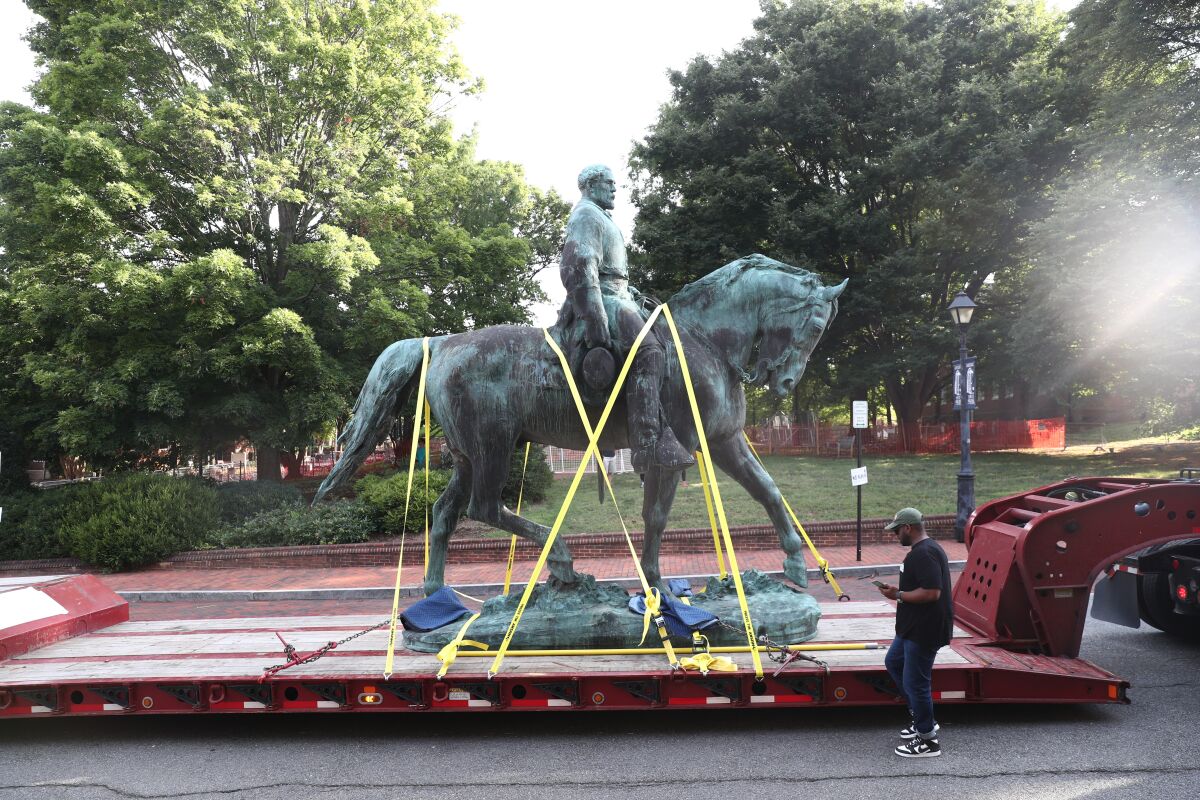 The monument of Robert E. Lee is removed on Saturday, July 10, 2021 in Charlottesville, Va. The removal of the Lee and Jackson statues comes nearly four years after violence erupted at the infamous “Unite the Right” rally. (Erin Edgerton/The Daily Progress via AP)