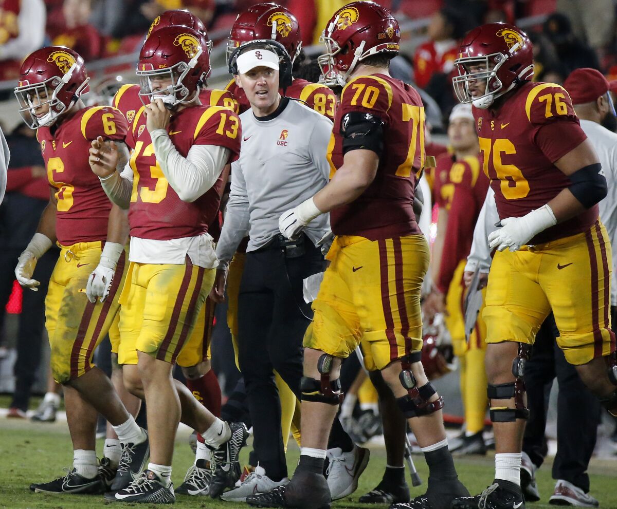 USC coach Lincoln Riley talks with his players on the sideline during the fourth quarter against Notre Dame.