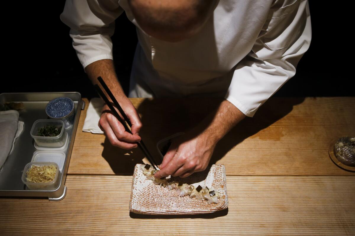 Chef David Schlosser prepares Japanese sea bream.