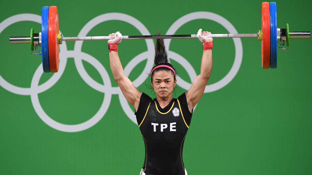 Tawain's Hsu Shu-Ching finished a lift during the women's 53kg competition on Sunday.