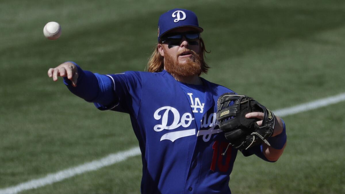 Dodgers third baseman Justin Turner, shown during an exhibition game in early March, hits his first home run in spring training on Wednesday.