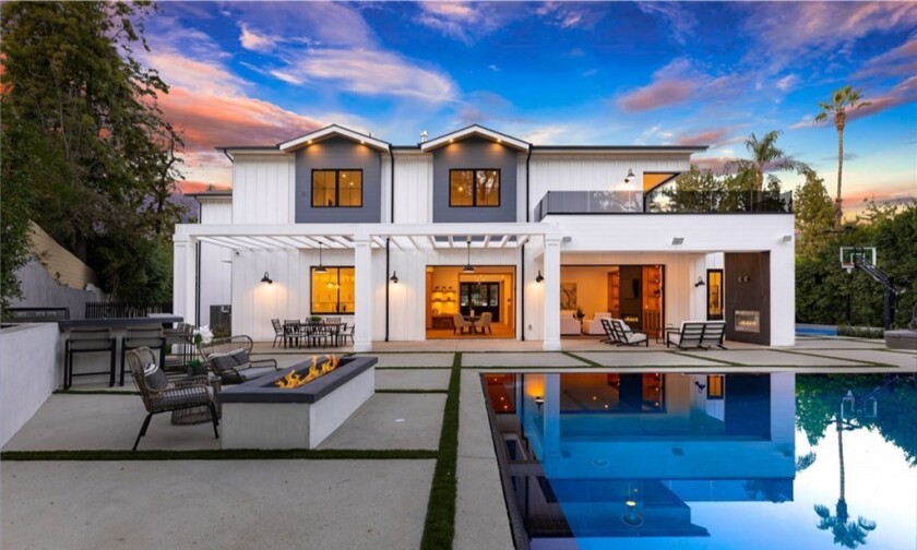 Built in 2019, the two-story farmhouse purchased by Steve Blackman draws the eye with a sleek black, white and gray exterior.