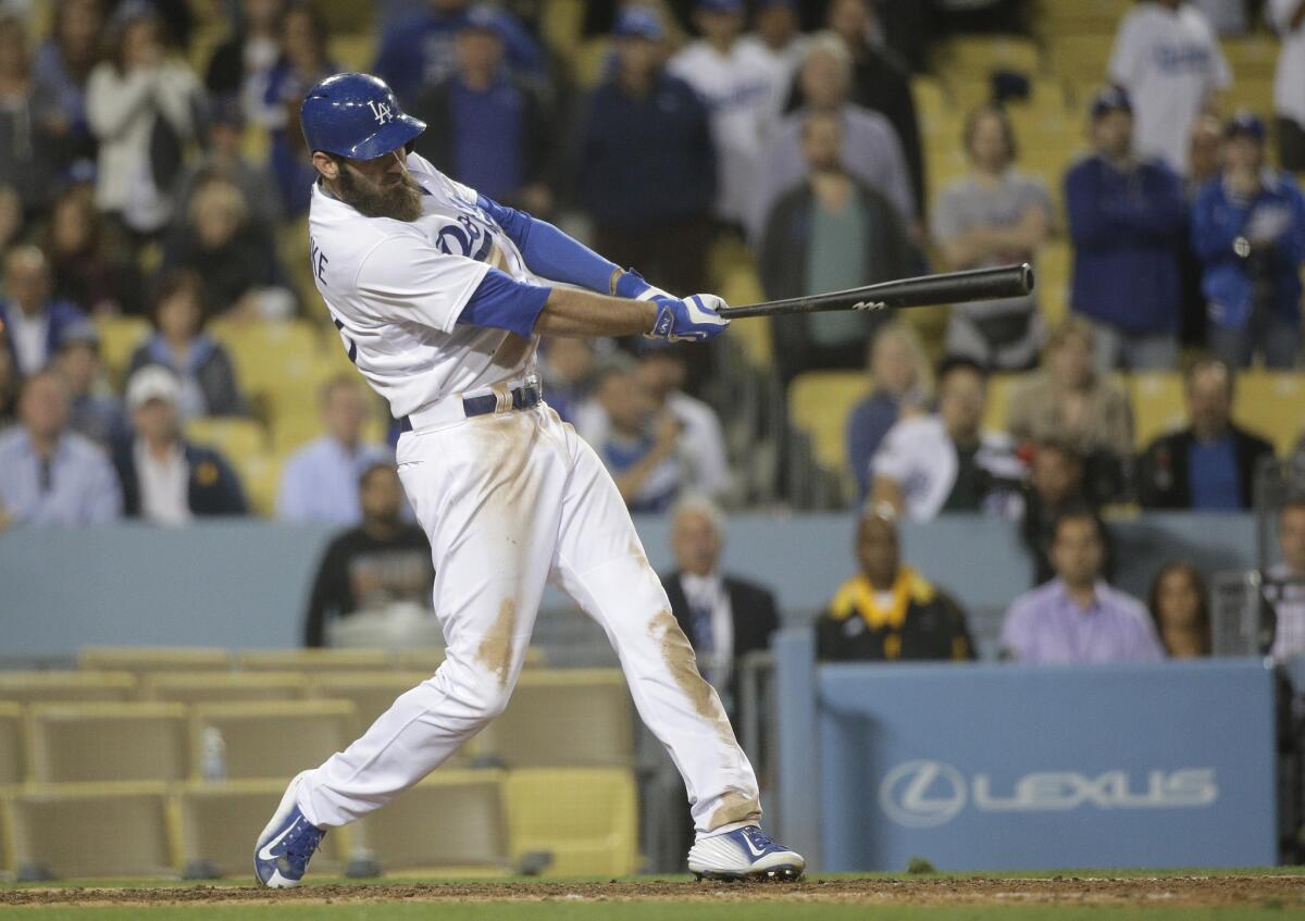Dodgers left fielder Scott Van Slyke connects for a game-winning, three-run home run against the Marlins in the ninth inning on May 11.