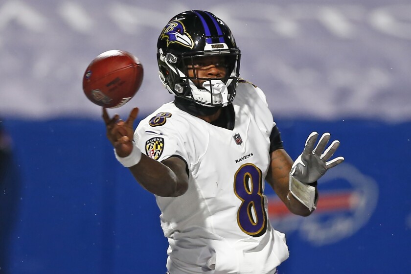 Baltimore Ravens quarterback Lamar Jackson (8) throws a pass during the first half of an NFL divisional round football game against the Buffalo Bills Saturday, Jan. 16, 2021, in Orchard Park, N.Y. (AP Photo/John Munson)