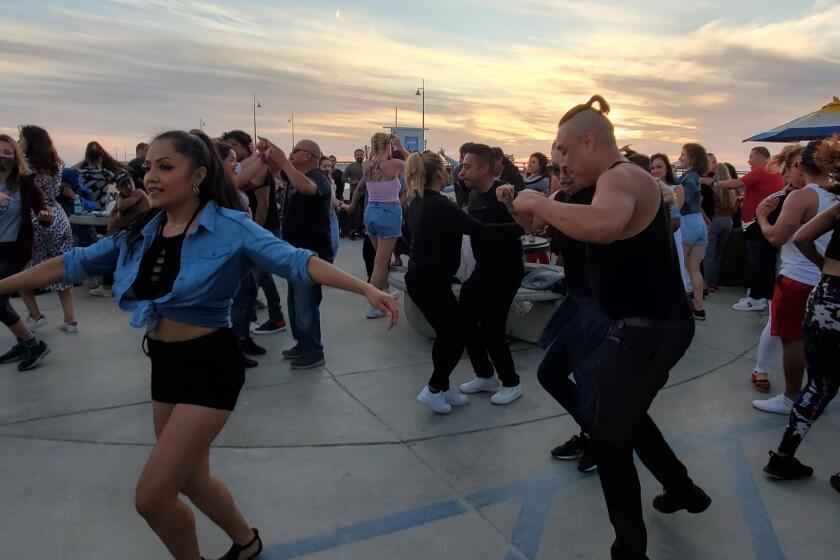 Approaching a new dance floor is always intimidating. Here, Angelenos dance to salsa and bachata near the Venice Pier as Covid-19 figures continue to drop and restrictions ease.