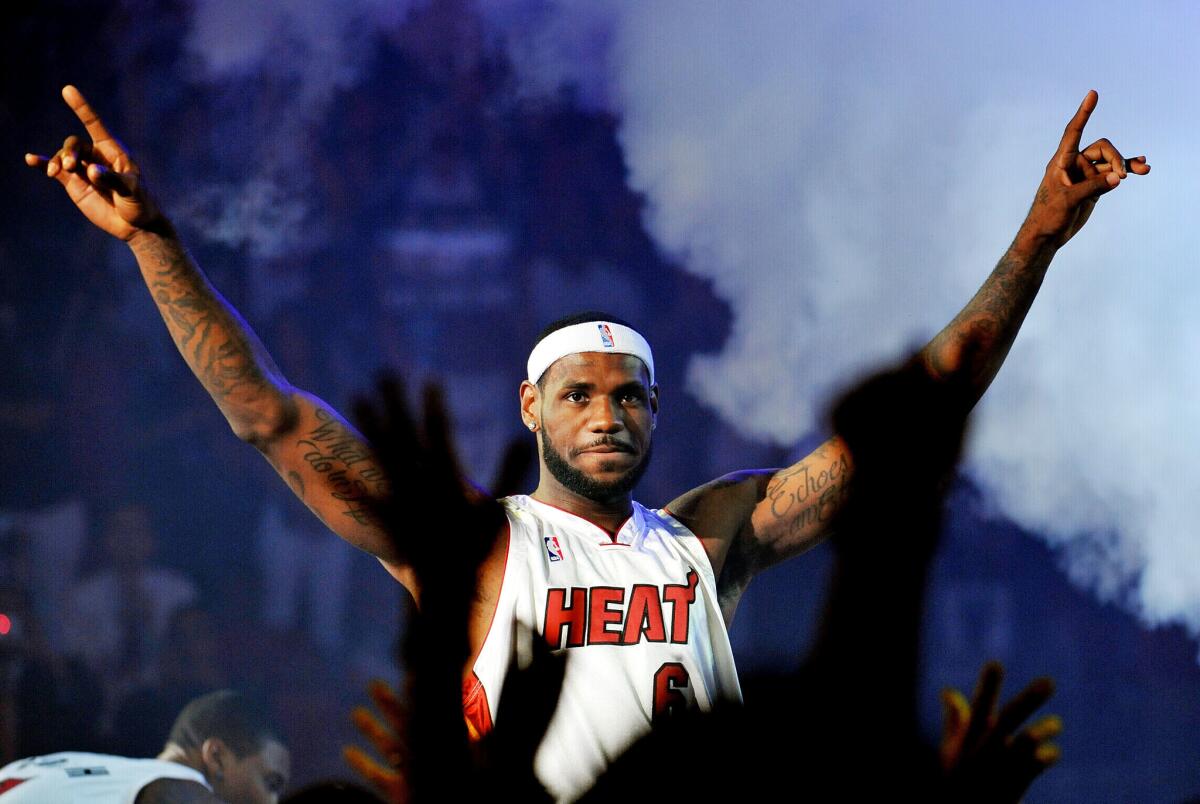 LeBron James #6 of the Miami Heat greets fans as he is introduced during a welcome party at American Airlines Arena on July 9, 2010 in Miami, Florida.