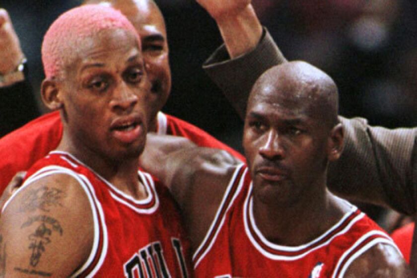 Dennis Rodman, left, shown with the Chicago Bulls in 1996, made his infamous trip to North Korea this year after former teammate Michael Jordan turned it down.