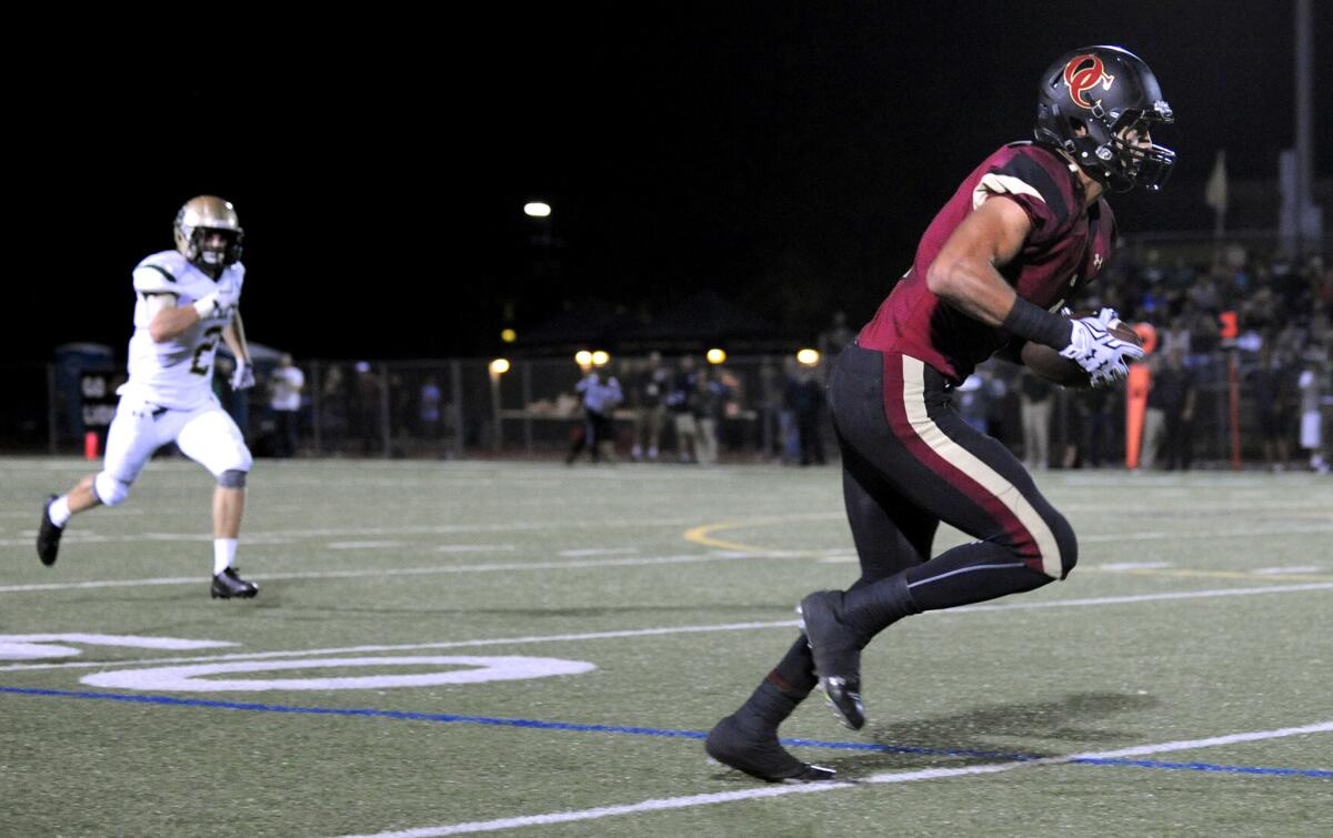 Oaks Christian receiver Michael Pittman is wide open behind the St. Bonaventure secondary for a touchdown in the first quarter.