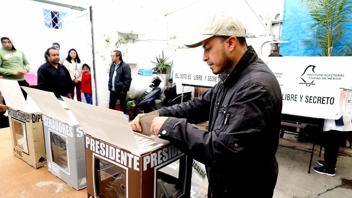 Mexicans go to the polls to vote for a new president in Colonia La Malinche in Mexico City on July 1. Also up for grabs are 500 seats of the Chamber of Deputies and 128 in the Senate.