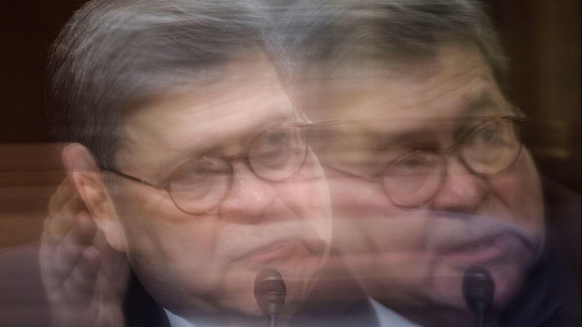 A picture taken with slow shutter speed shows Attorney General William Barr testifying before the Senate Judiciary Committee in Washington on May 1.