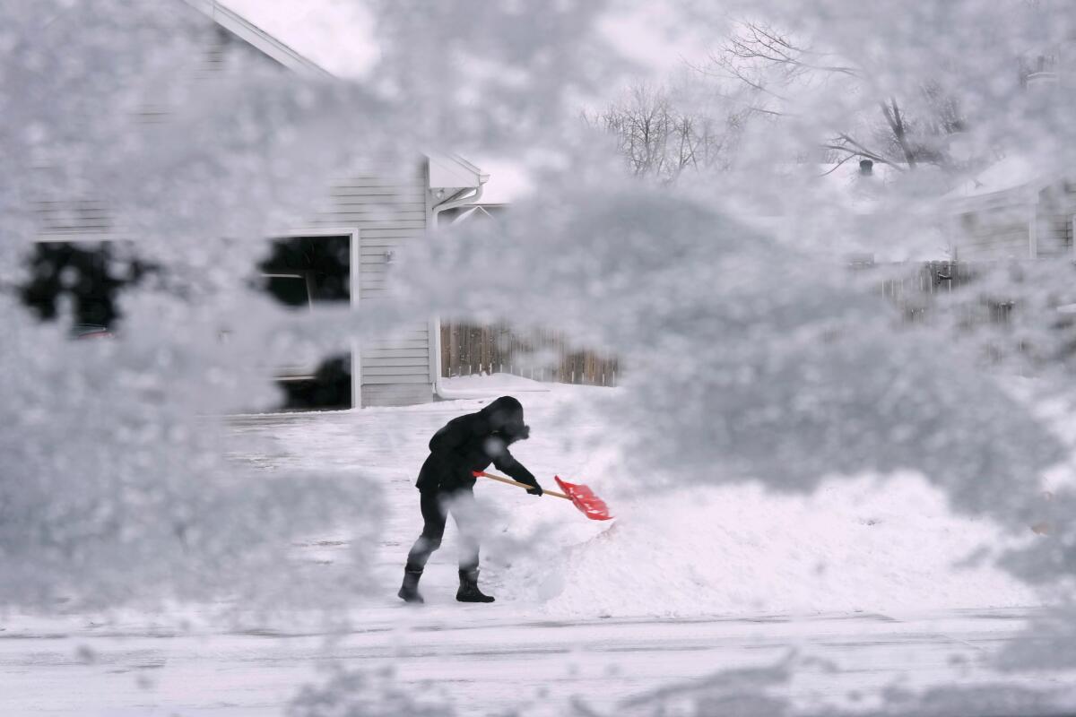 A person shovels snow 