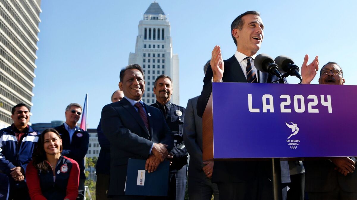 Los Angeles Mayor Eric Garcetti addresses the media and public gathered at Grand Park in downtown Los Angeles as plans to bring the Olympics back to Southern California go forward.
