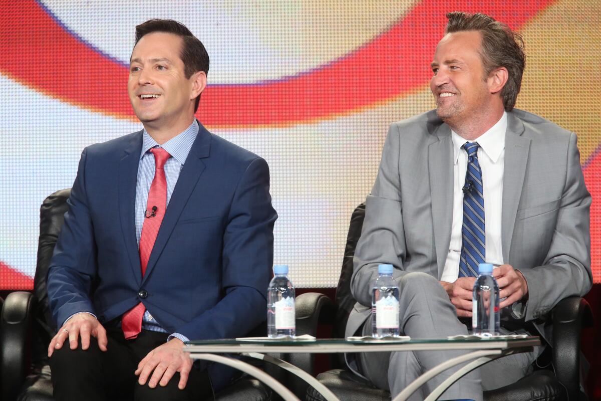 Thomas Lennon, left, and Matthew Perry speak onstage during "The Odd Couple" panel as part of the TCA press tour in Pasadena on Monday. The new CBS series, in which Lennon will play Felix Unger and Perry will play Oscar Madison, will premiere Feb. 19.