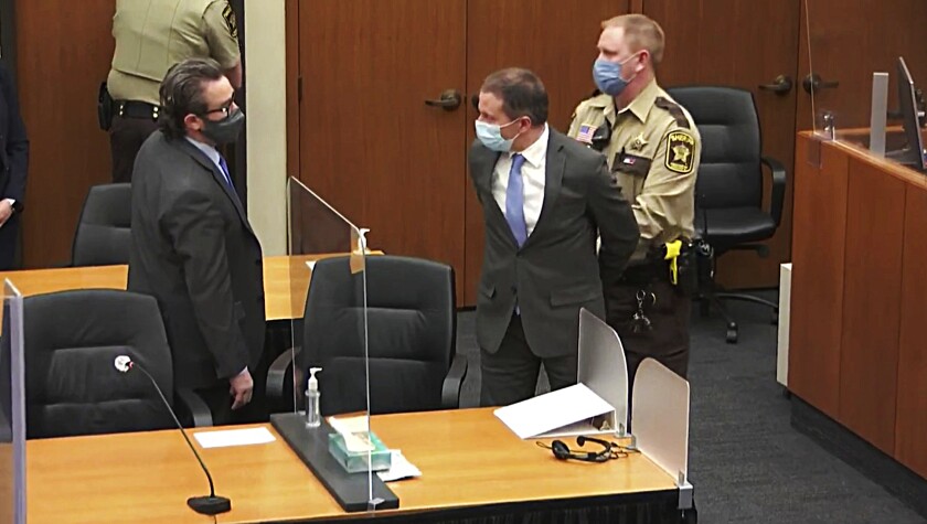 Derek Chauvin is handcuffed in court. 