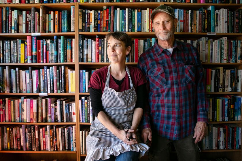 YREKA, CA - MARCH 04: Guy and Debbie Scott, owners of Zephyr Books & Coffee in Yreka, poses for a portrait on {wdt} in Yreka, CA. Zephyr Books & Coffee in rural Northern California serves as a location to sign a petition to recall Gavin Newsome. (Jason Armond / Los Angeles Times)