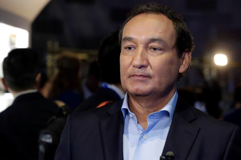 United Airlines CEO Oscar Munoz waits to be interviewed Thursday, June 2, 2016, in New York, during a presentation of the carrier's new Polaris service, a new business class product that will become available on trans-Atlantic flights. (AP Photo/Richard Drew)