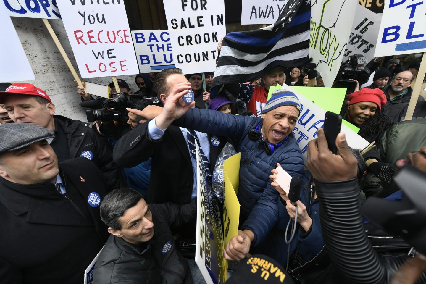 Dueling protestors clash over Cook County State's Attorney Kim Foxx's office's decision to drop all charges against "Empire" actor Jussie Smollett, on April 1, 2019, in Chicago.