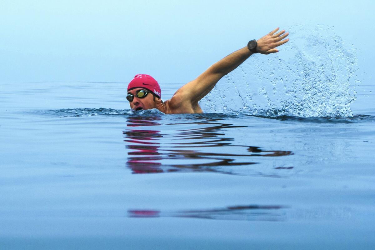Joe McCauley swims in waters off Santa Monica Beach after getting help with his aquaphobia.