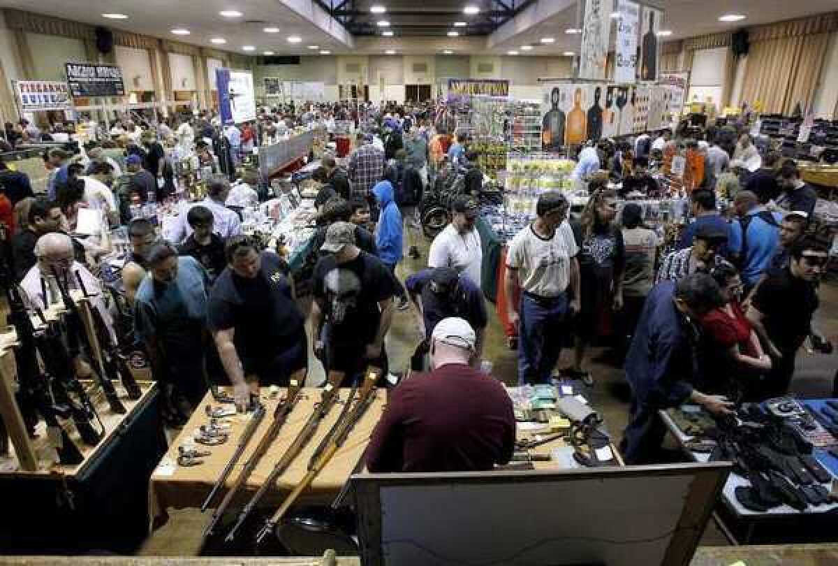 People gather for what may be the last gun show at the Glendale Civic on March 2, 2013.
