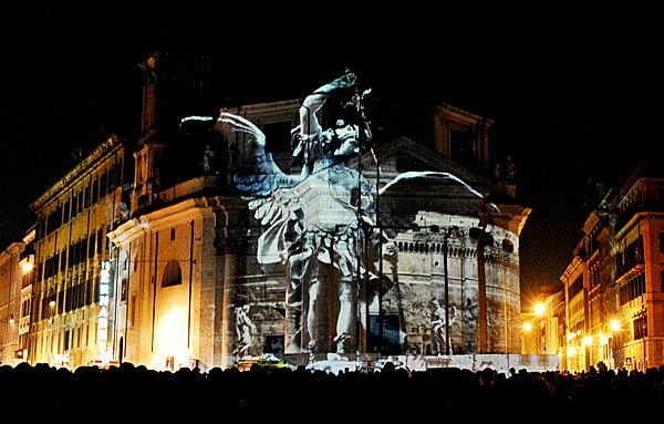 The image of an angel is projected onto the Church of the Piazza del Popolo during a performance to celebrate the anniversary of the city of Rome's founding in 753 BC.