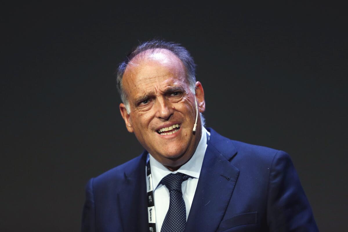 FILE - In this Monday, Sept. 24, 2018 file photo, Javier Tebas, the president of the Spanish La Liga, speaks during the World Football summit in Madrid, Spain. Tebas has accused Real Madrid president Florentino Perez of being behind the surprising announcement that Barcelona is pushing forward with the idea of a European Super League. In an interview The Associated Press on Wednesday, Oct. 28, 2020 he said it was Perez who prodded outgoing Barcelona president Josep Bartomeu to talk about the proposed new league in an effort to give it more credibility. (AP Photo/Paul White, File)