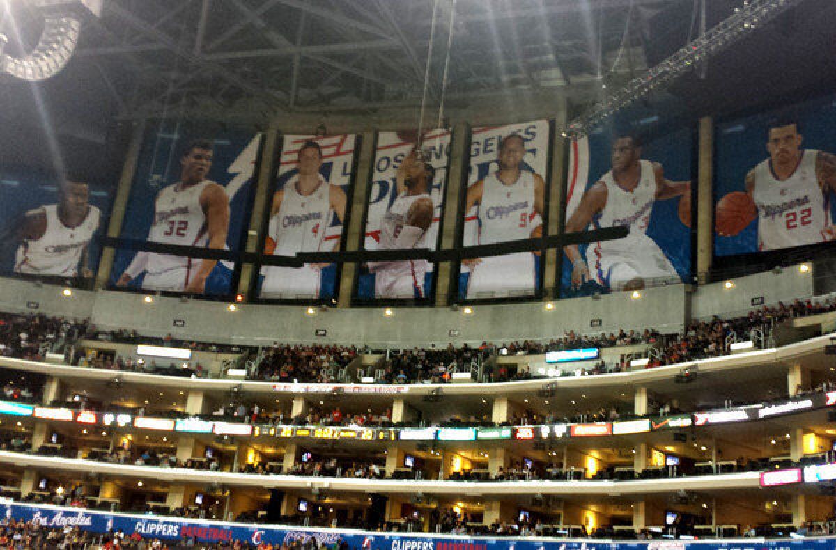 Banners of Clippers players block the view of the Lakers' championship banners at Staples Center.