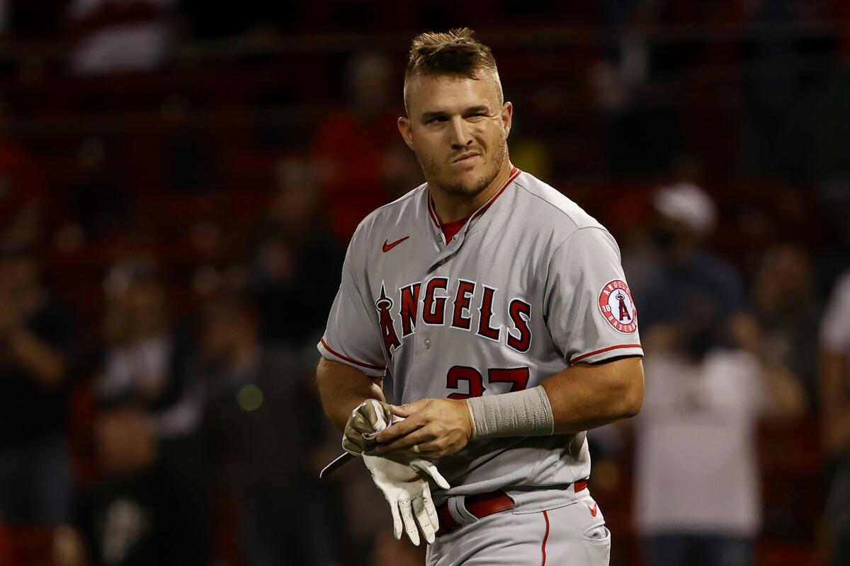 Angels' Mike Trout looks toward the dugout after striking out.