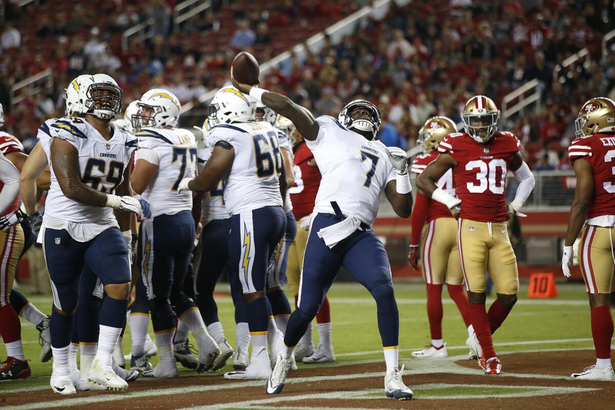 Los Angeles Chargers quarterback Cardale Jones (7) throws the ball as he celebrates a touchdown scored by running back Terrell Watson during the first half of an NFL preseason football game against the San Francisco 49ers in Santa Clara, Calif., Thursday, Aug. 30, 2018.