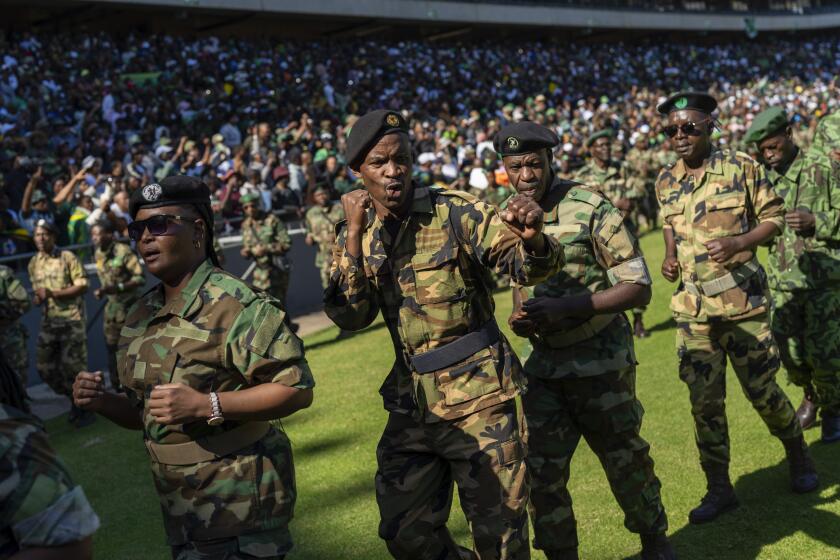 Veteran fighters parade as they wait for former South African President Jacob Zuma to arrive at Orlando stadium in the township of Soweto, Johannesburg, South Africa, for the launch of his newly formed uMkhonto weSizwe (MK) party's manifesto Saturday, May 18, 2024. Zuma, who has turned his back on the African National Congress (ANC) he once led, will face South African President Cyril Ramaphosa, who replaced him as leader of the ANC in the general elections later in May. (AP Photo/Jerome Delay)