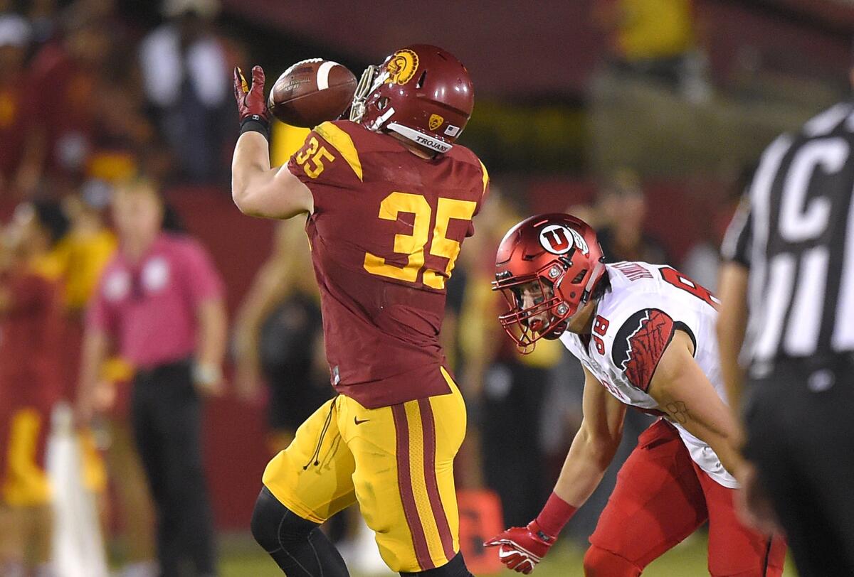 USC linebacker Cameron Smith (35) intercepts a pass from Utah quarterback Travis Wilson during the second half of the Trojans' 42-24 win over the previously unbeaten Utes.