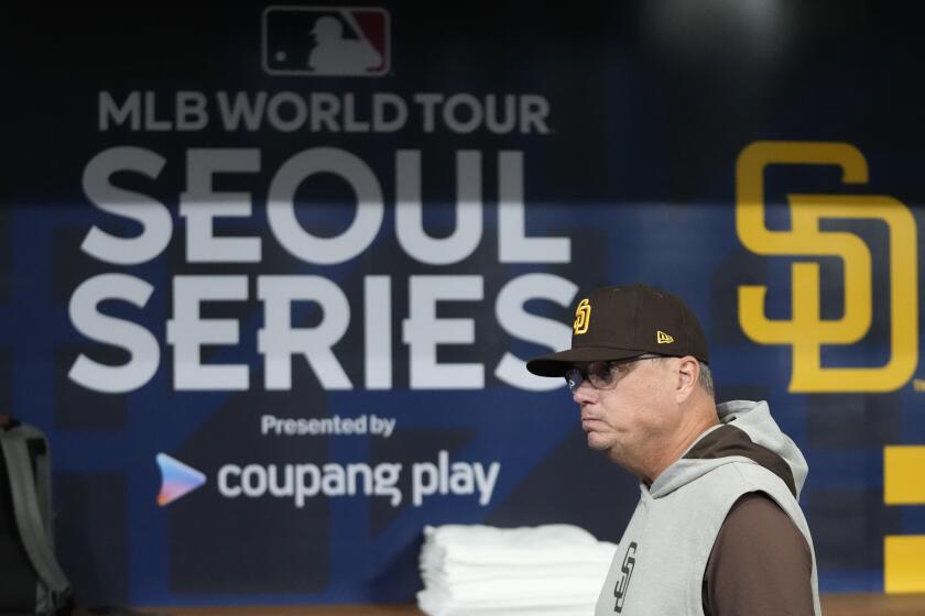 San Diego Padres manager Mike Shildt walks during a baseball workout at the Gocheok Sky Dome in Seoul, South Korea, Tuesday, March 19, 2024. Major League Baseball's season-opening games between the Los Angeles Dodgers and San Diego Padres in Seoul will be the first MLB games held in the baseball-loving nation.(AP Photo/Lee Jin-man)
