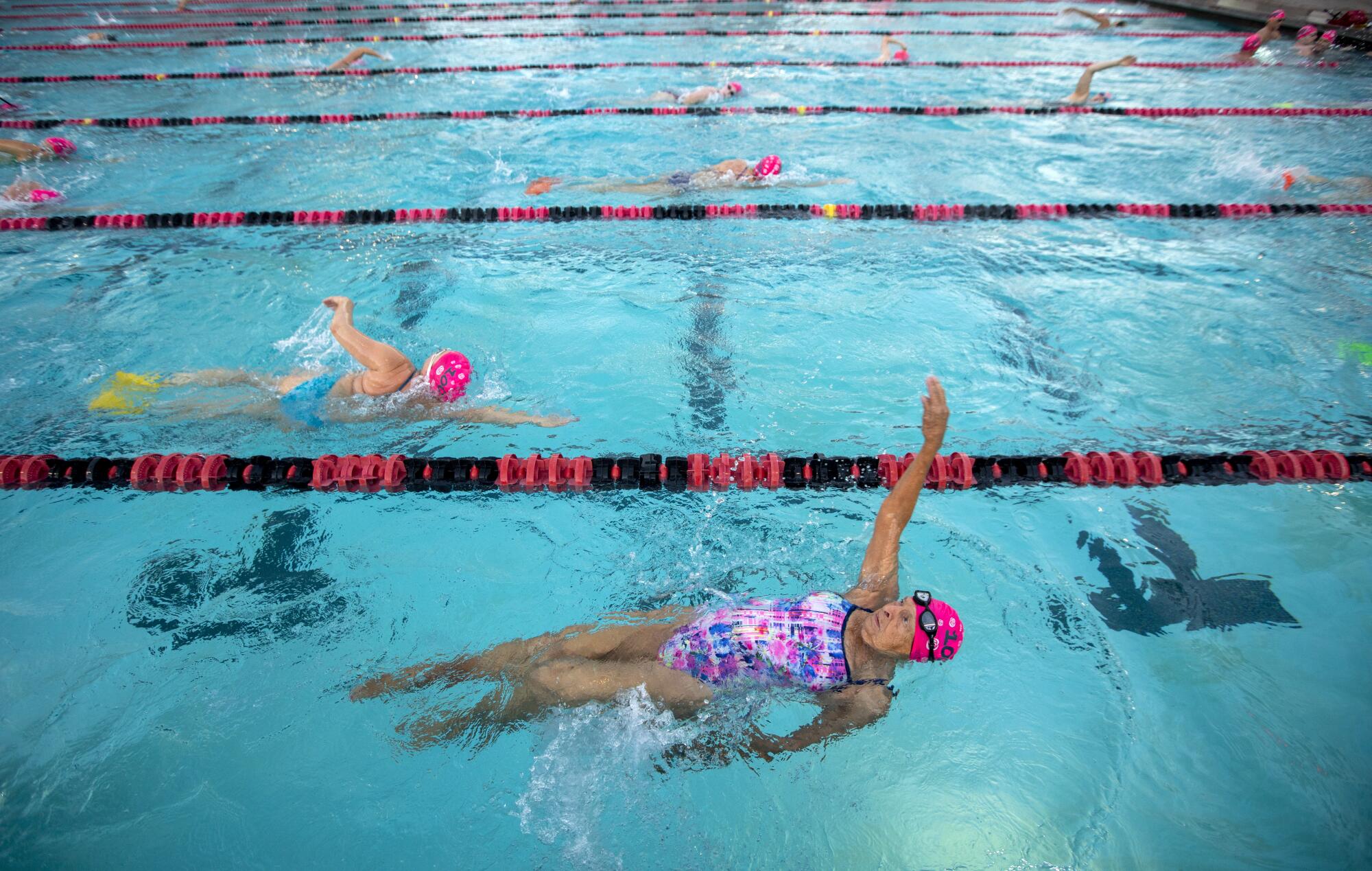 Maurine Kornfeld swims the back stroke.