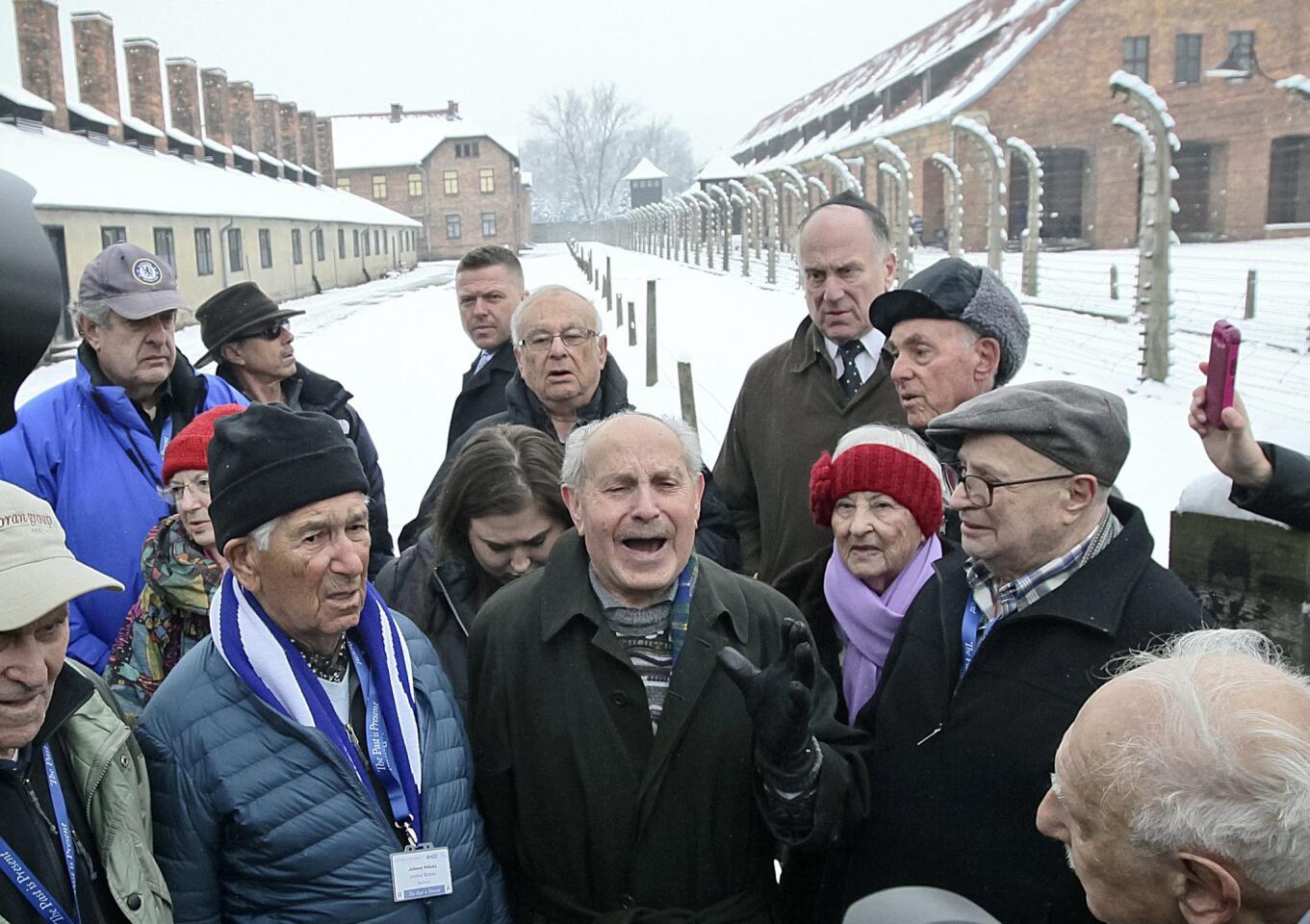 Survivors pray at Auschwitz