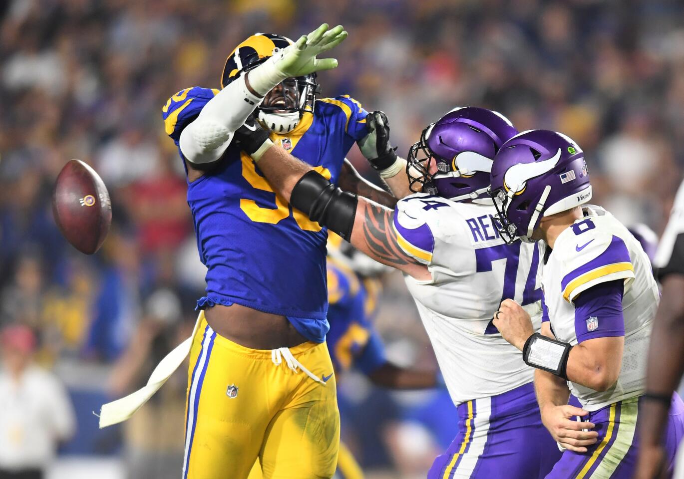 Rams defensive lineman Michael Brockers forces Vikings quarterback Kirk Cousins into a fumble late in the 4th quarter. The Rams recovered to preserve the win.