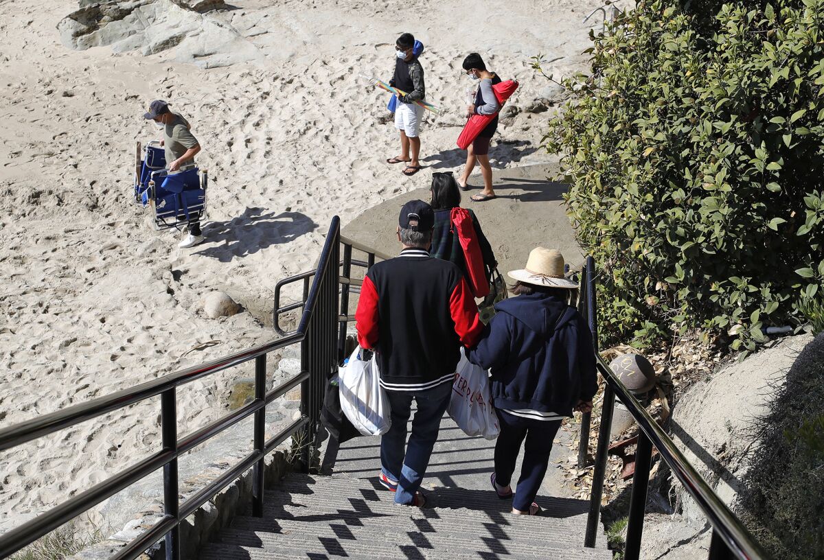 Visitors arrive to Rockpile Beach in Laguna on Wednesday, April 21.