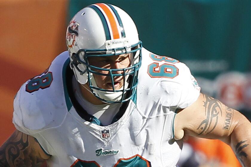 Miami Dolphins guard Richie Incognito defends during a game against the Seattle Seahawks in 2012. Incognito appears close to signing with the Buffalo Bills.
